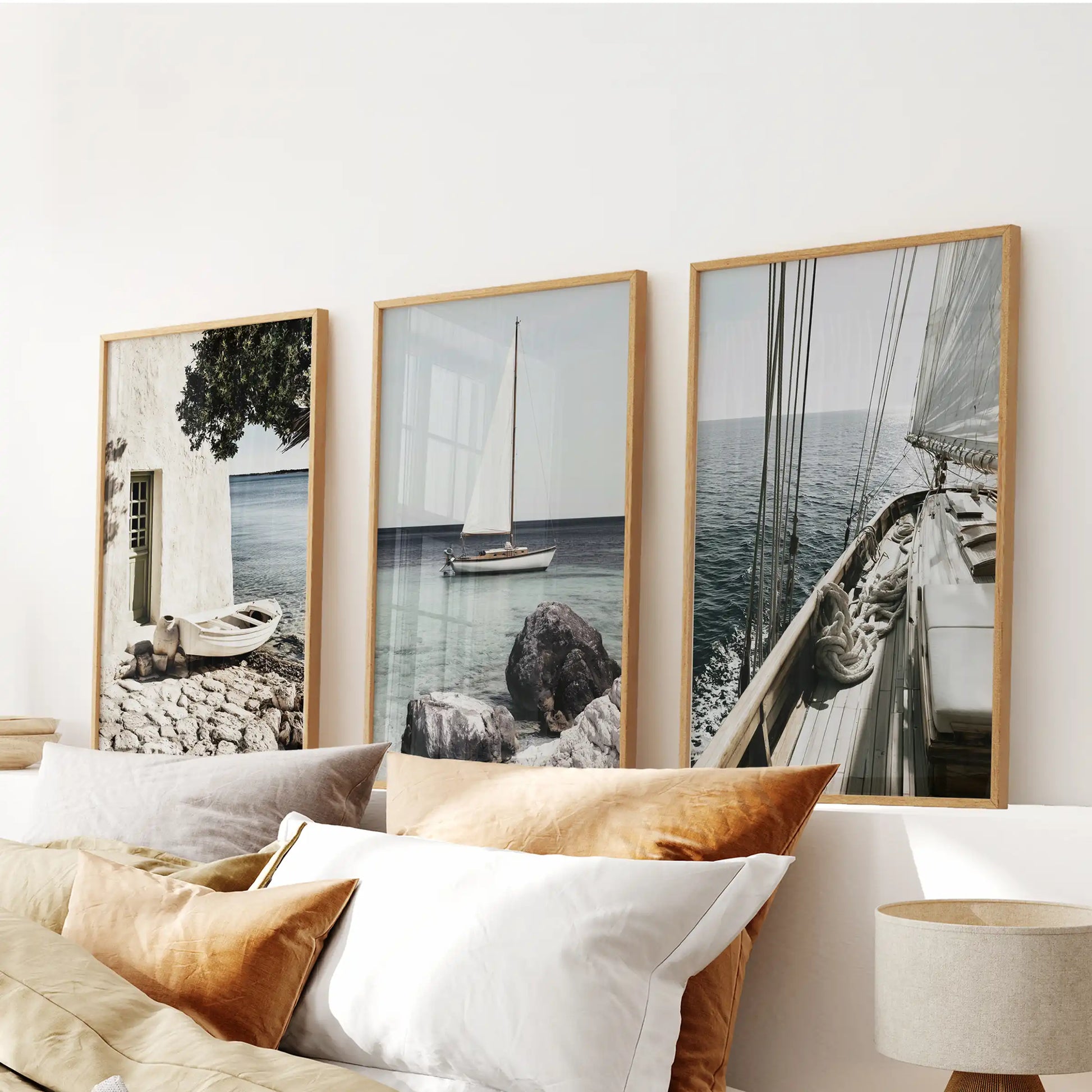 Riviera coastline photography, 3 pc wall art set, crowns the bedroom over the headboard in solid oak frames, combining warmth with fresh seaside color.