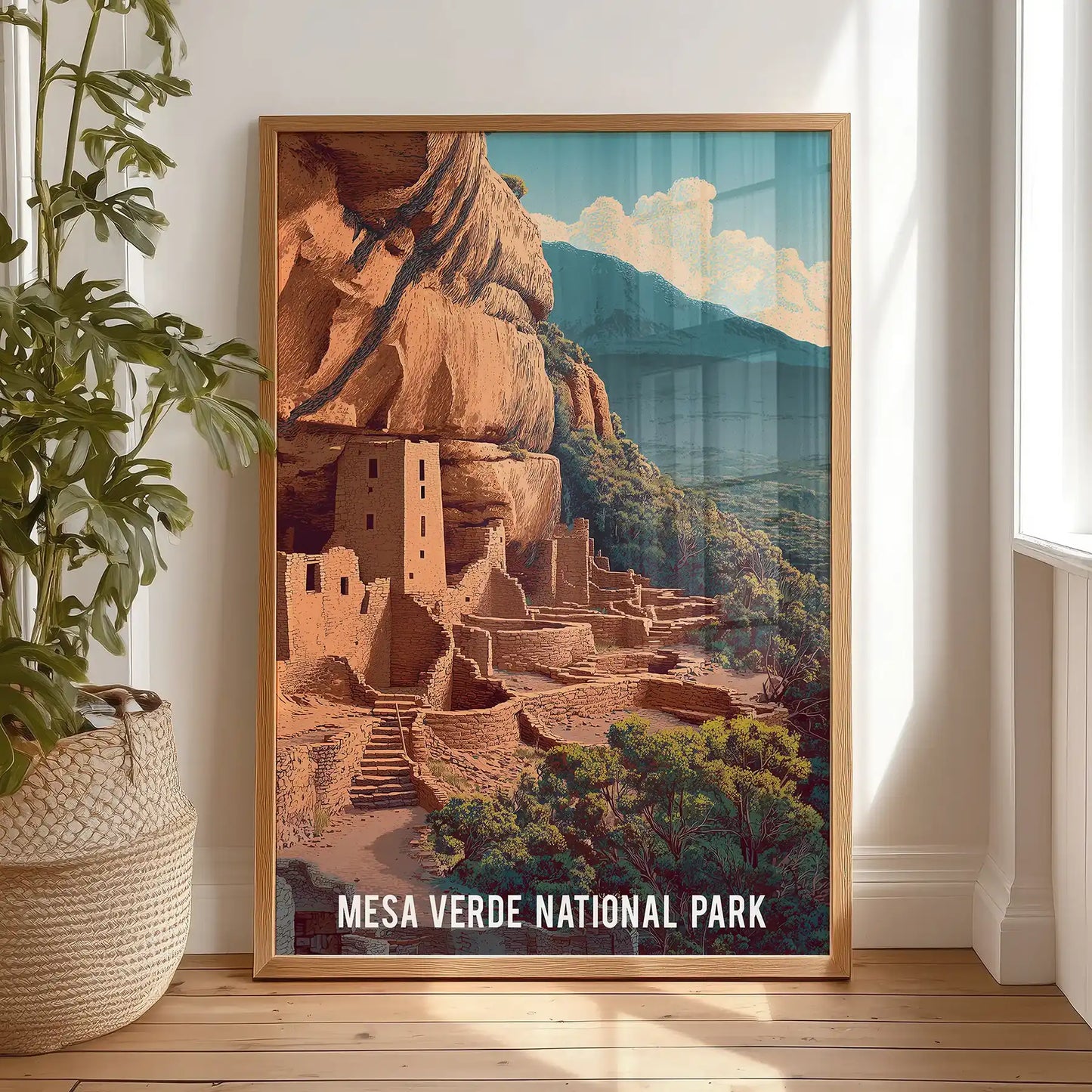 Colorado national park wall art piece in an oak wood frame rests on the bedroom floor, leaning casually to show its warm, rustic palette.