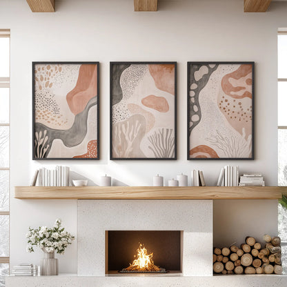 Terracotta geometric patterns, 3-piece wall art in black frames, styled over the fireplace mantel to anchor a relaxed lounge.