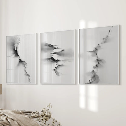 Three minimalist landscape posters in airy white frames arrange beside the bed, keeping the bedroom wall balanced and calm.