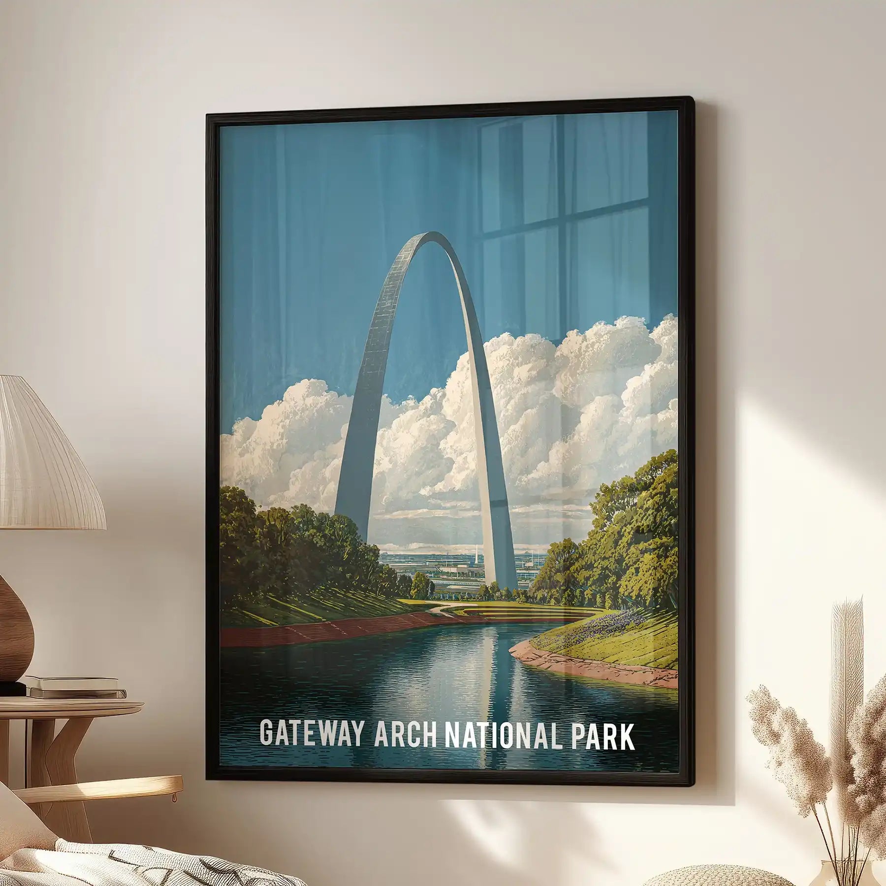 Gateway Arch National Park statement wall art print in a matte black frame brings modern landmark flair to the living room above a cozy chair.