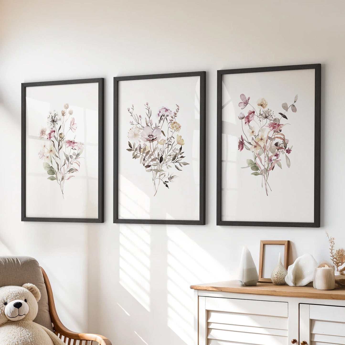 This 3-piece set of minimalist botanical prints in crisp black frames rests above the kids’ dresser, keeping the room light and modern.