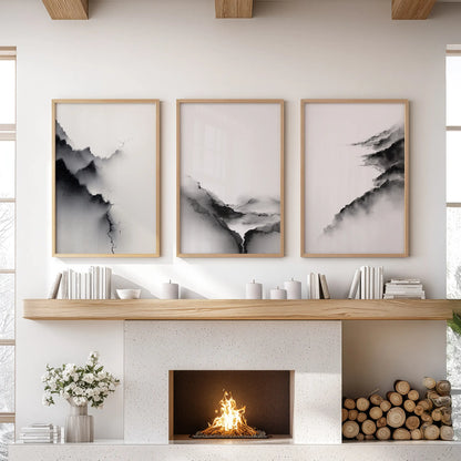 Black and white abstract mountains in a three-piece wall decor set, oak framed, crown the living room space above the fireplace mantel.
