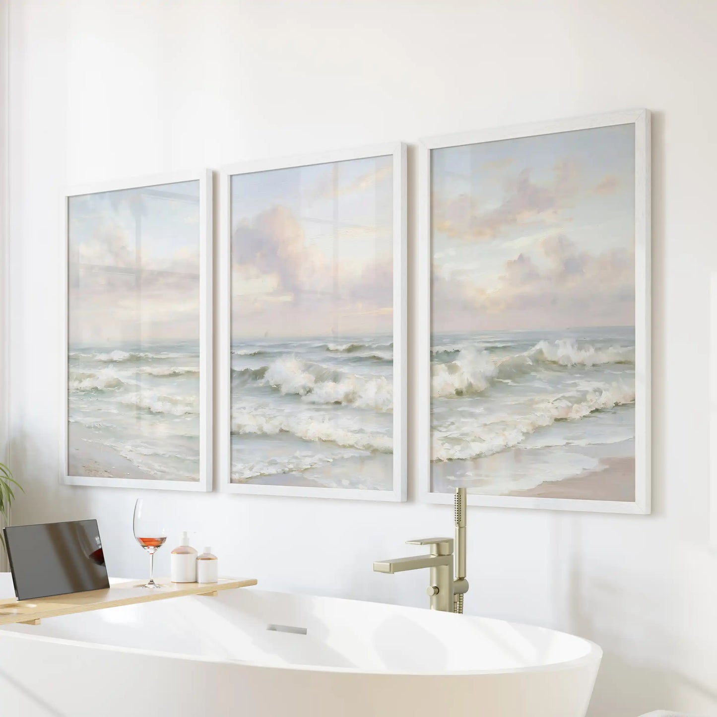 Gentle surf and tide, an art set of 3 in crisp white frames, turns the bathroom serene when mounted over a freestanding tub.