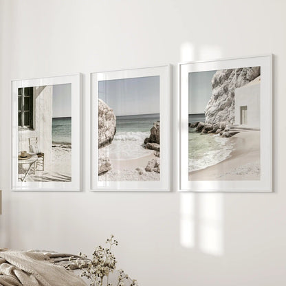 Minimalist ocean scenes, set of 3 posters in white matted frames, land on the wall beside the bed to keep the bedroom airy and composed.