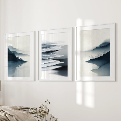 Three seascape pictures in white-matted frames line the bedroom wall by the bed, lending a simple, modern coastal ease.