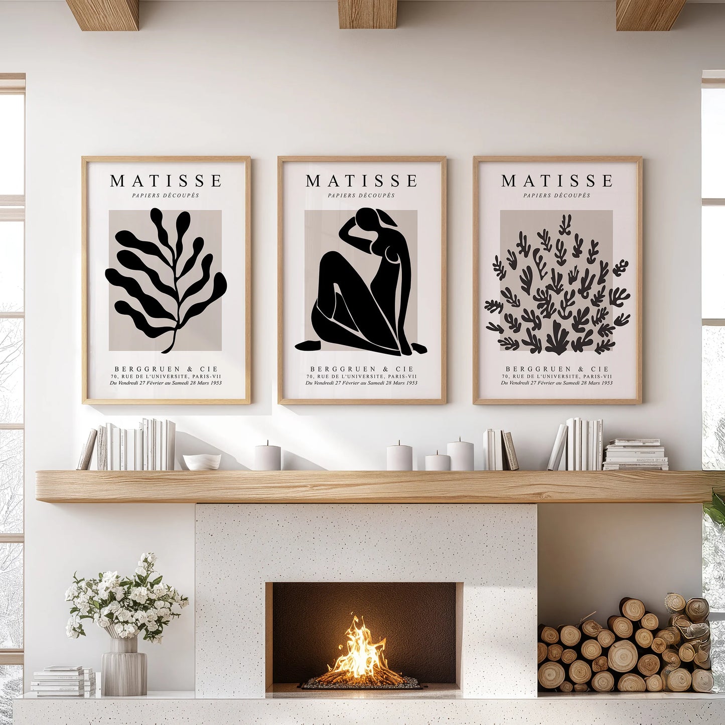 Mid-century modern art, a three-piece wall art set in warm wood frames, anchors the sitting room wall over the mantel.