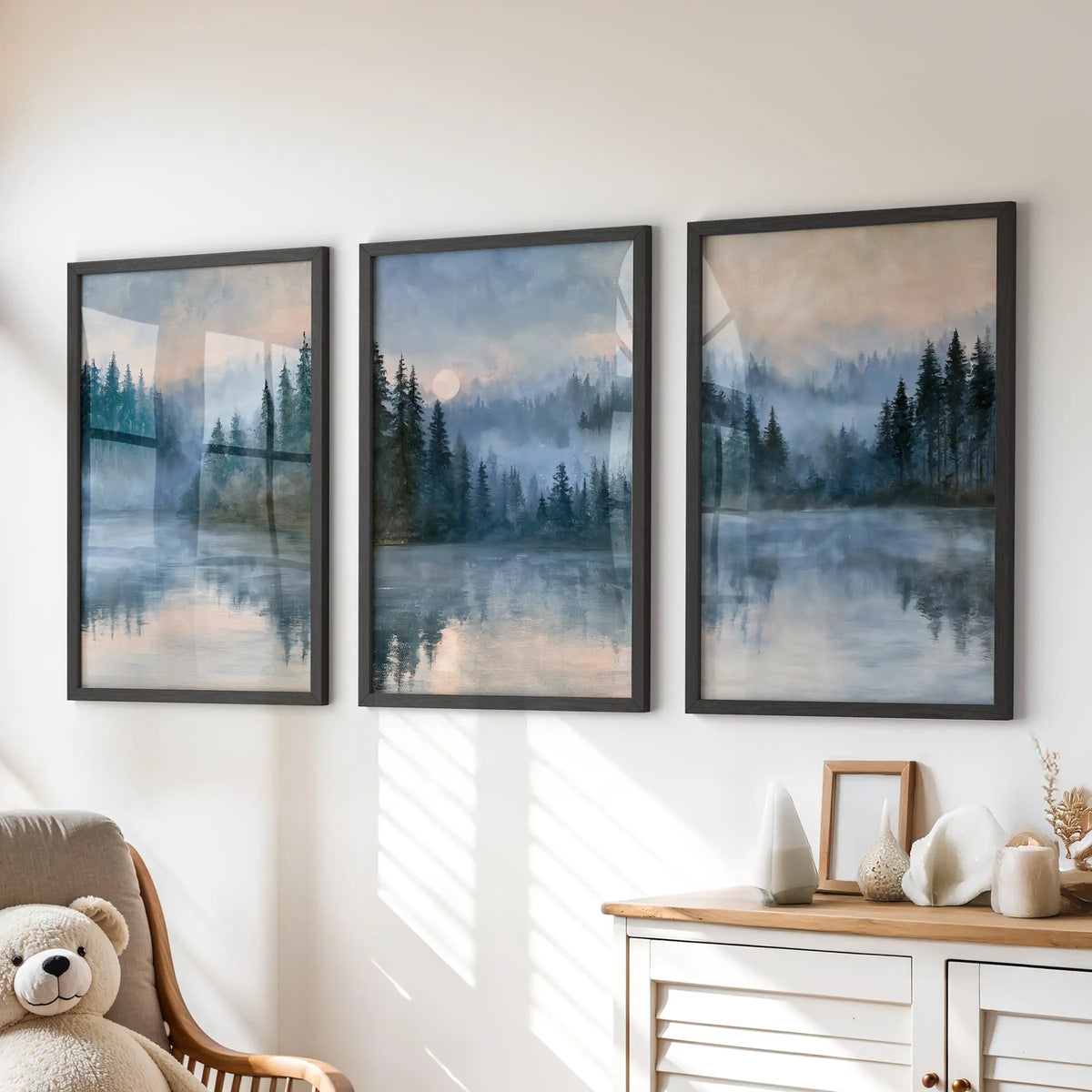 Tranquil water reflections 3-piece wall art set in black framed prints sits neatly over the chest of drawers, adding serene blue scenery to a peaceful kids room.