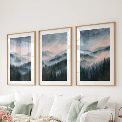 Misty mountain forest framed prints, a three-piece art set with mats in natural wood, installed above the sectional in the living room.