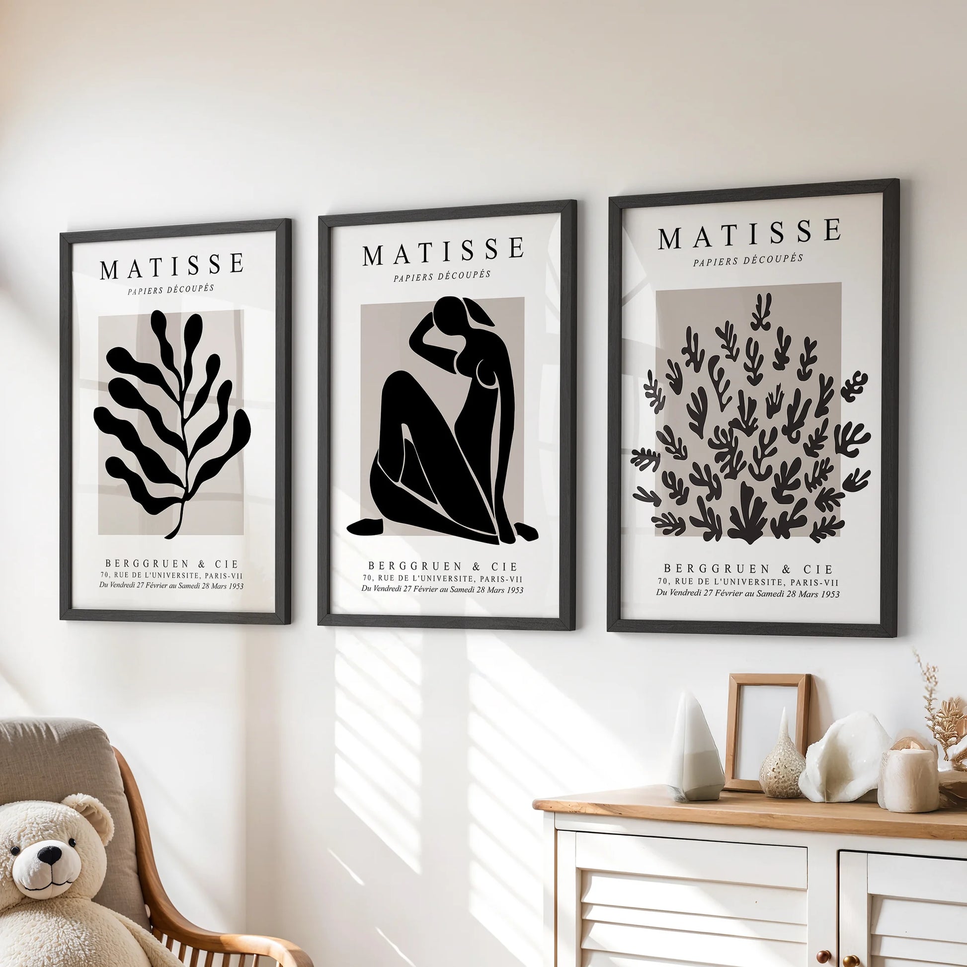 A trio of black-framed prints in a playful Matisse style brings color and shape above the children’s chest of drawers.