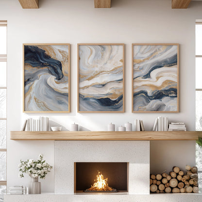 Blue and beige fluid swirls with subtle gold, set of three art prints, warm the sitting room in light wood frames over the mantle.