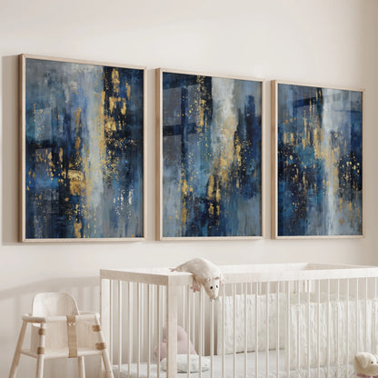An oak-framed poster trio in blue and gold tones hangs over the crib, forming a soft focal wall for the infant room.