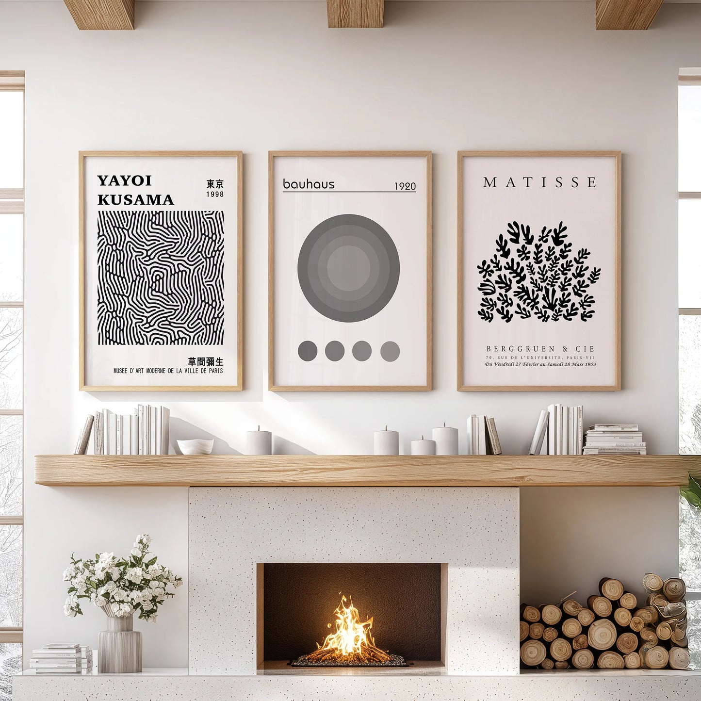 Museum exhibition posters, a 3-piece wall set, center the space over the mantle in oak wood frames, giving the living room a curated art-house feel.
