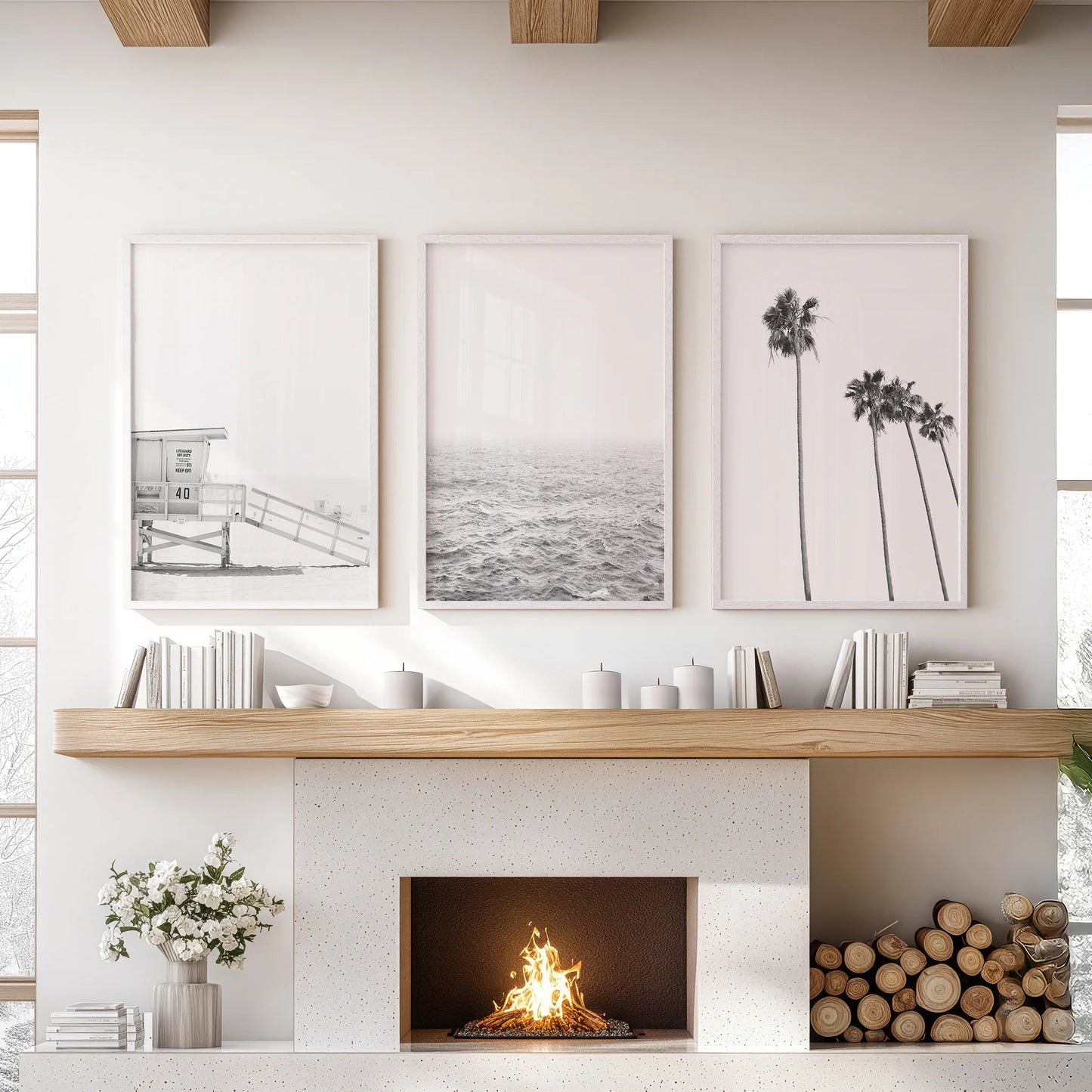 This three-print wall art set of an ocean shoreline spans the lounge in white frames, creating a serene focus above the hearth.