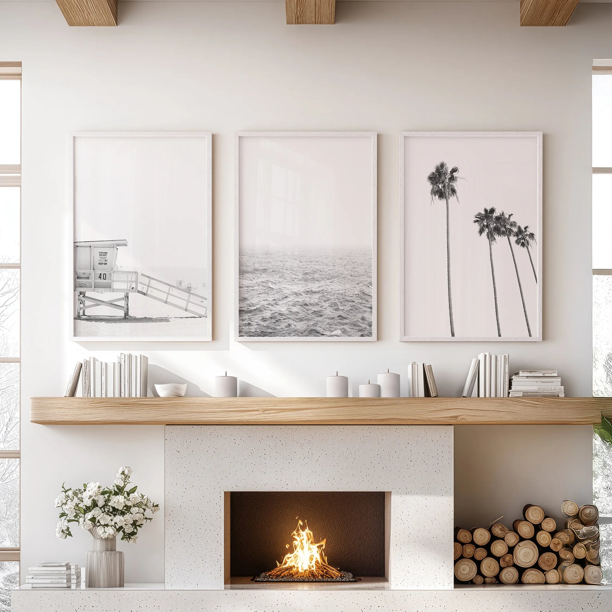 This three-print wall art set of an ocean shoreline spans the lounge in white frames, creating a serene focus above the hearth.