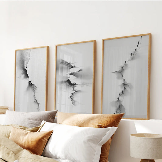 Minimalist nature wall art, a 3-print bundle in solid oak frames, crowns the bedroom wall over the headboard with quiet, graphic lines.