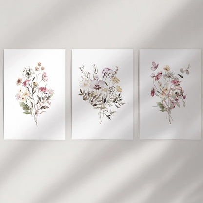 Wildflower bouquets, an unframed wall art set of 3, brings airy color to a blank wall with softly painted stems and petals.