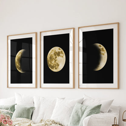 Black-and-gold lunar design, a 3 poster bundle in oak framed prints with mats, spans the sitting room wall behind the sofa for striking modern art.