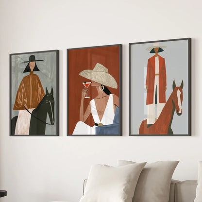 Black-framed wall art in a set of three shows horse and rider scenes above the living room sectional, bringing bold ranch character.