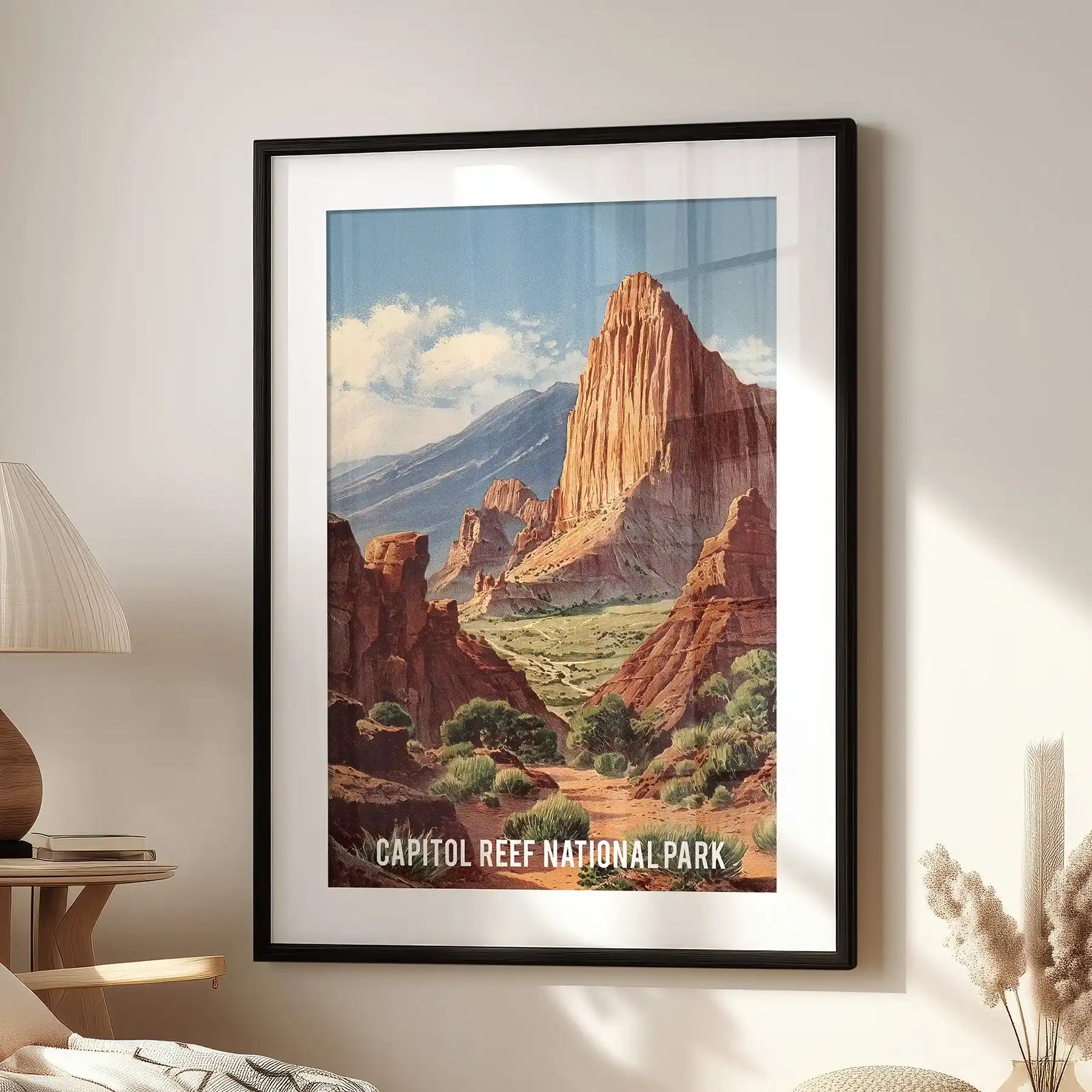 Statement wall decor of Utah’s monocline cliffs, set in a black frame with a white mat, brings a bold focal point to a lounge reading nook.