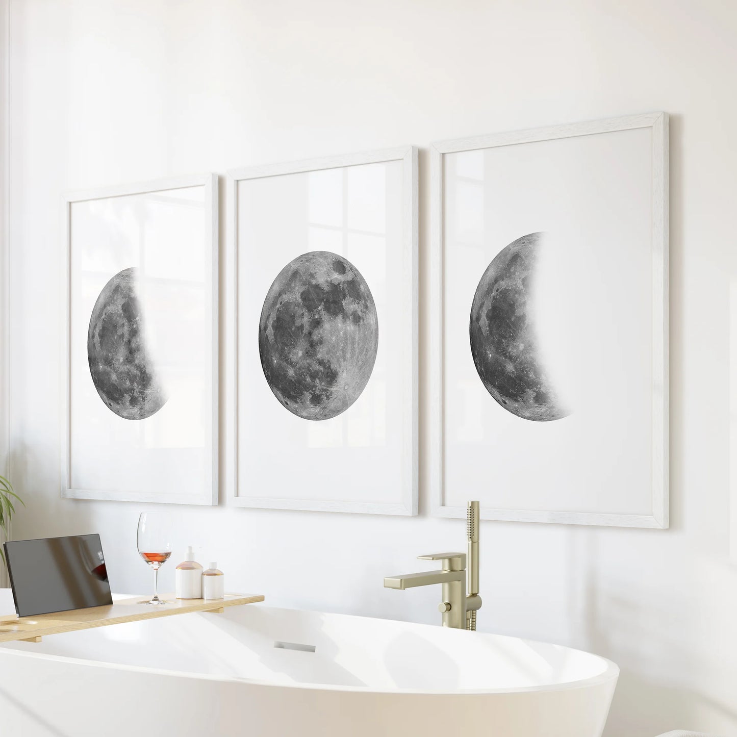 Crescent to full moon three-piece wall decor set in white frames creates serene wall art above the bathtub, giving the bathroom a quiet, lunar rhythm.