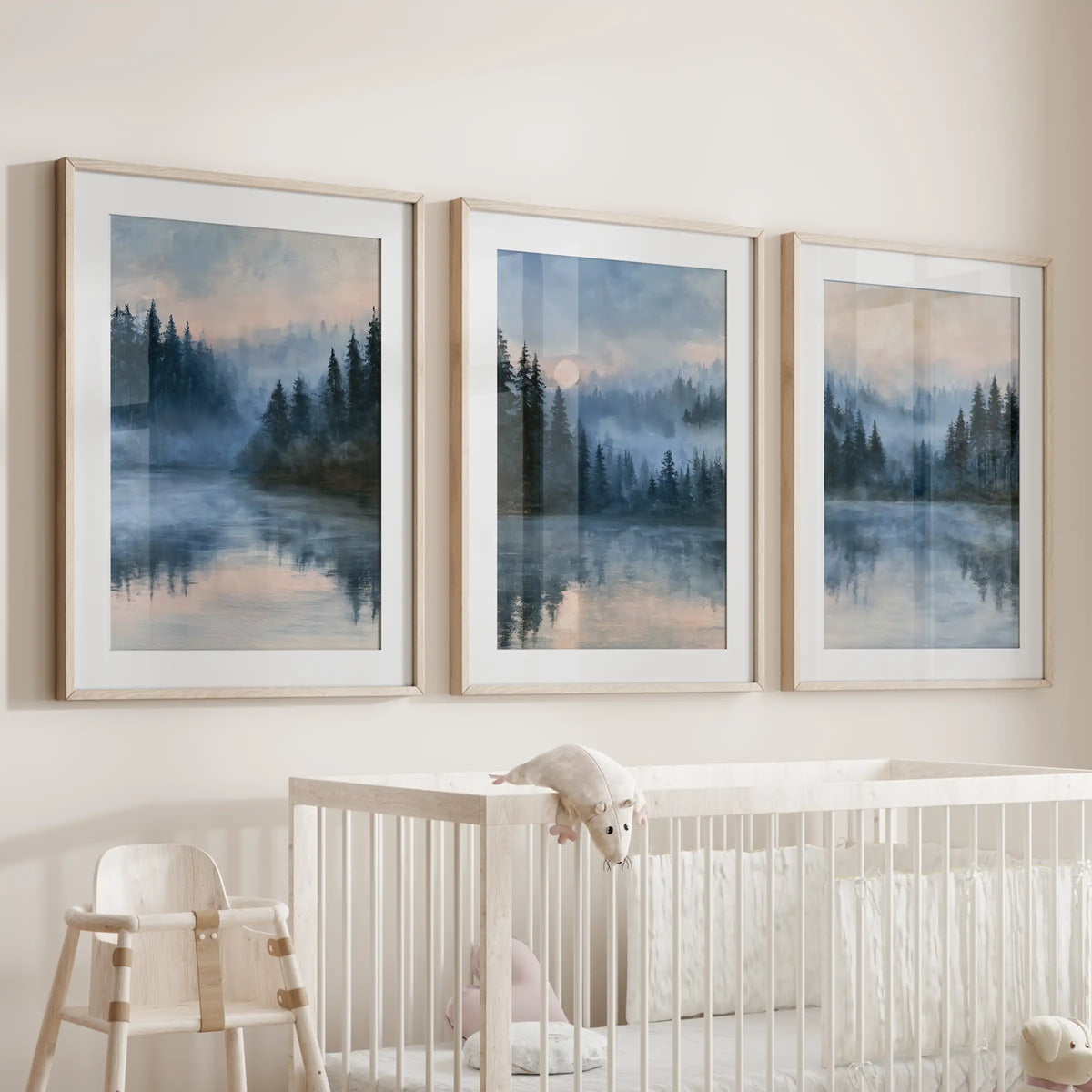 Serene lakeside wall art in a three-print set, wood framed with mats, hangs over the crib and brings gentle blues and soothing horizons to the nursery.