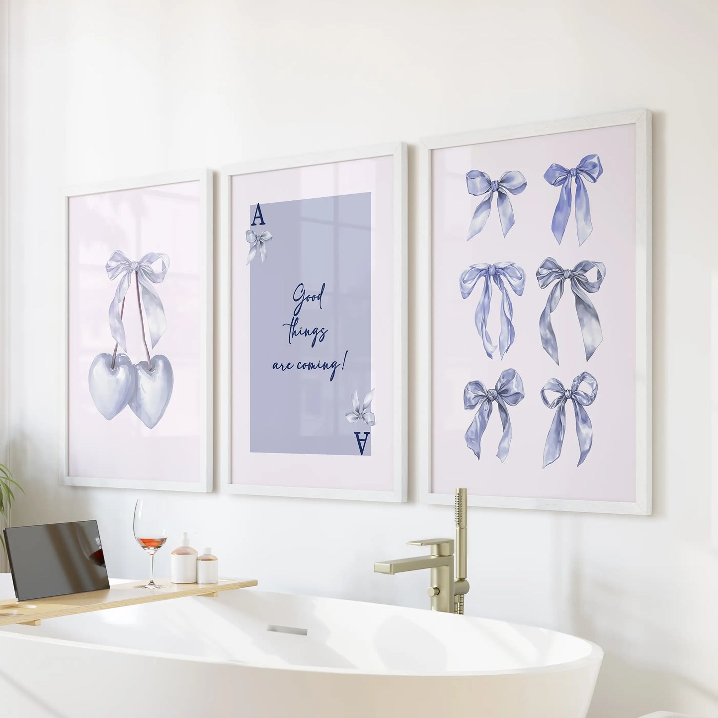 Good Things Are Coming typography wall art, three-print set, glows in white frames over the tub wall, lending calm encouragement to a bright bathroom.