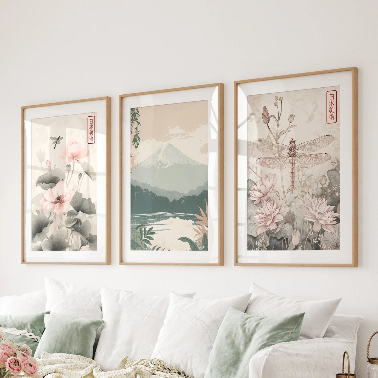 Mount Fuji landscape set of three posters in solid oak frames with mats, spanning the living room wall above the sectional for a serene horizon.