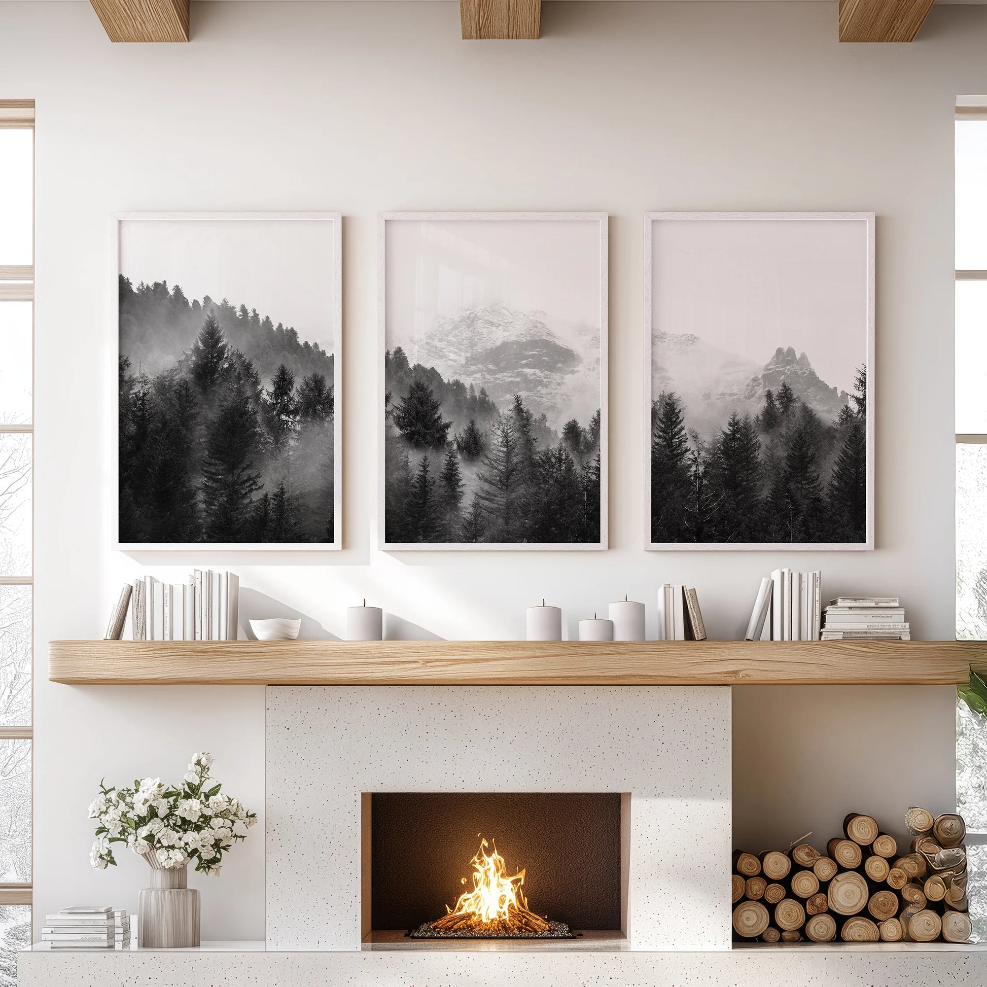 A set of three white-framed prints captures fog drifting through a mountain forest, meant for display above a mantelpiece.