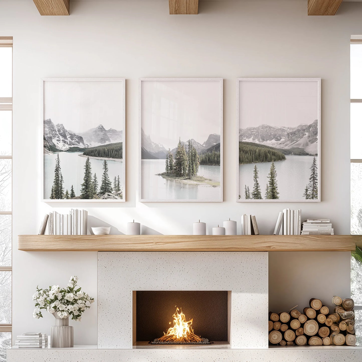 Canadian Rockies mountain peaks, a wall art trio in white frames, hangs above the mantel to lift the lounge with a bright, alpine horizon.