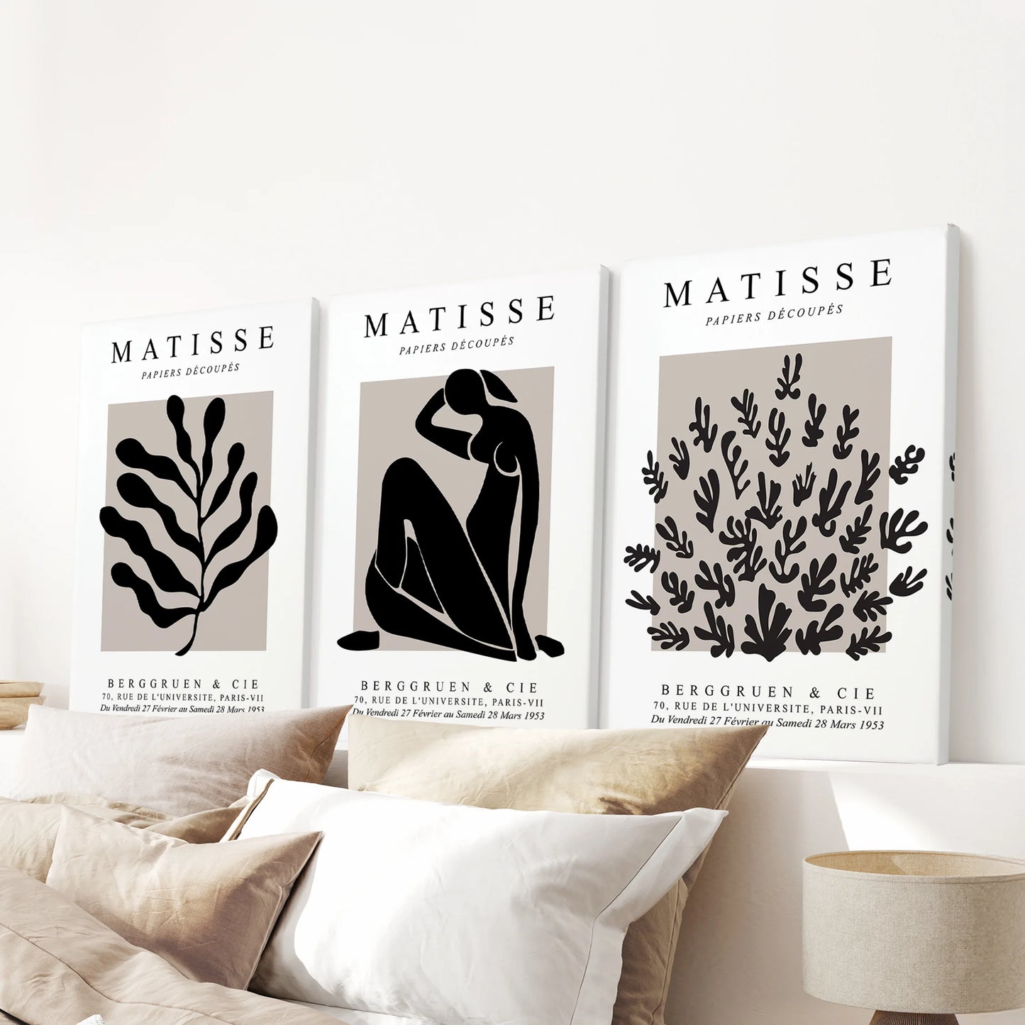 A coordinating trio of ready-to-hang canvas prints gives the bedroom wall above the headboard a balanced, modern finish.