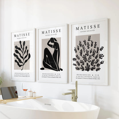 Minimal y2k posters, a wall art trio in white frames, float above the tub to give the bathroom a soft, modern note.