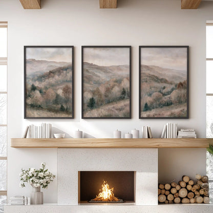 A three-poster wall art set of an autumn forest landscape hangs over the lounge fireplace in clean black frames, with a soft neutral feel.