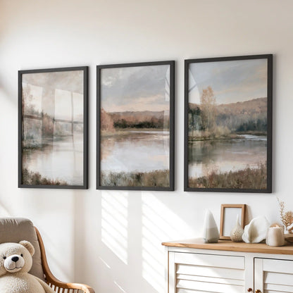 A set of three nature prints showing a muted shoreline and trees rests in black frames above the kids room dresser, adding gentle autumn color.