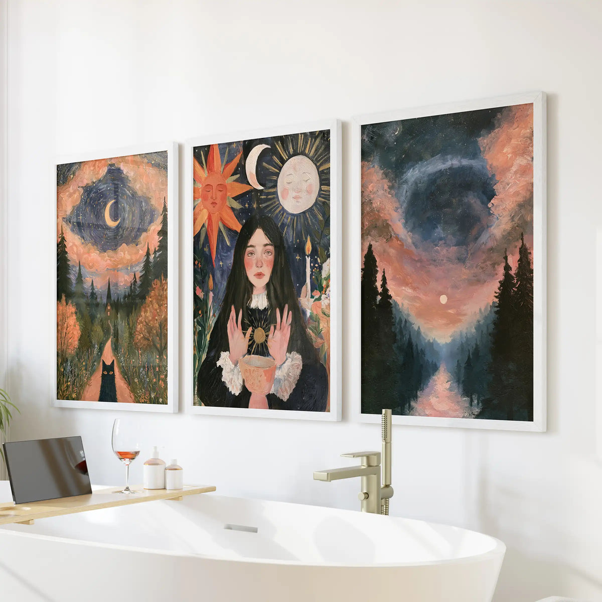 Moon phases over forest wall art trio set in white frames rests above the tub wall, bringing a serene celestial hush to the bathroom.