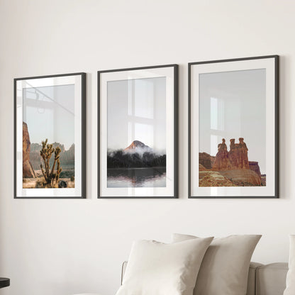 A three-piece wall art set in black-matted frames shows sandstone arches and buttes, neatly centering the lounge over the sofa.