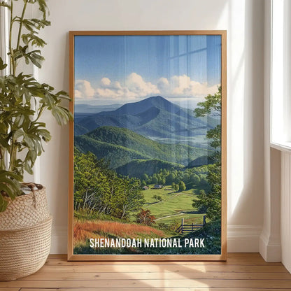 Blue Ridge Mountains artwork print in a thin wood frame leans on the bedroom floor against the wall, adding warm timber tones to the serene scene.