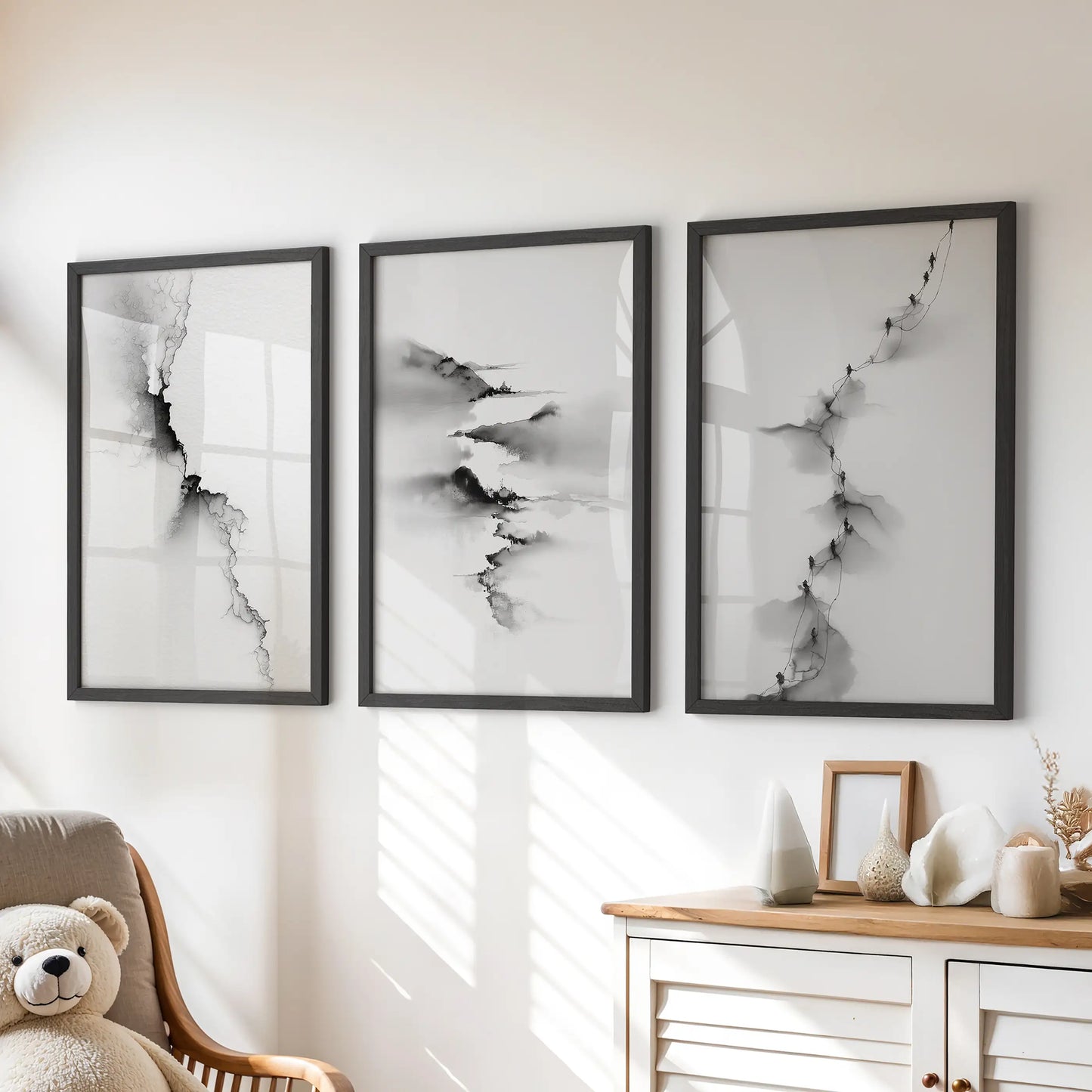 Three nature-inspired prints in neat black frames perch above the kids’ dresser, softening the playroom with gentle contrast.