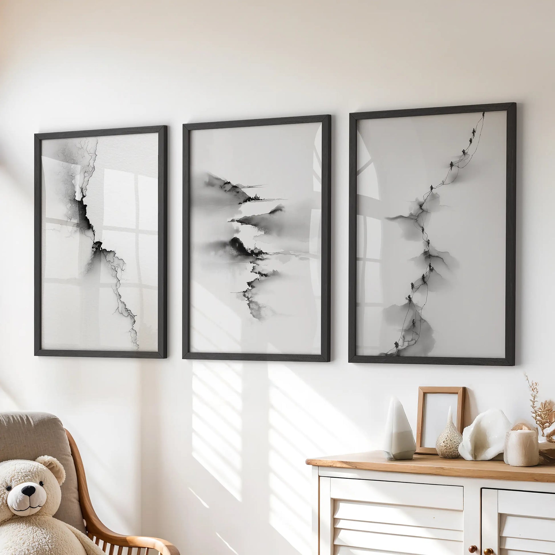 Three nature-inspired prints in neat black frames perch above the kids’ dresser, softening the playroom with gentle contrast.