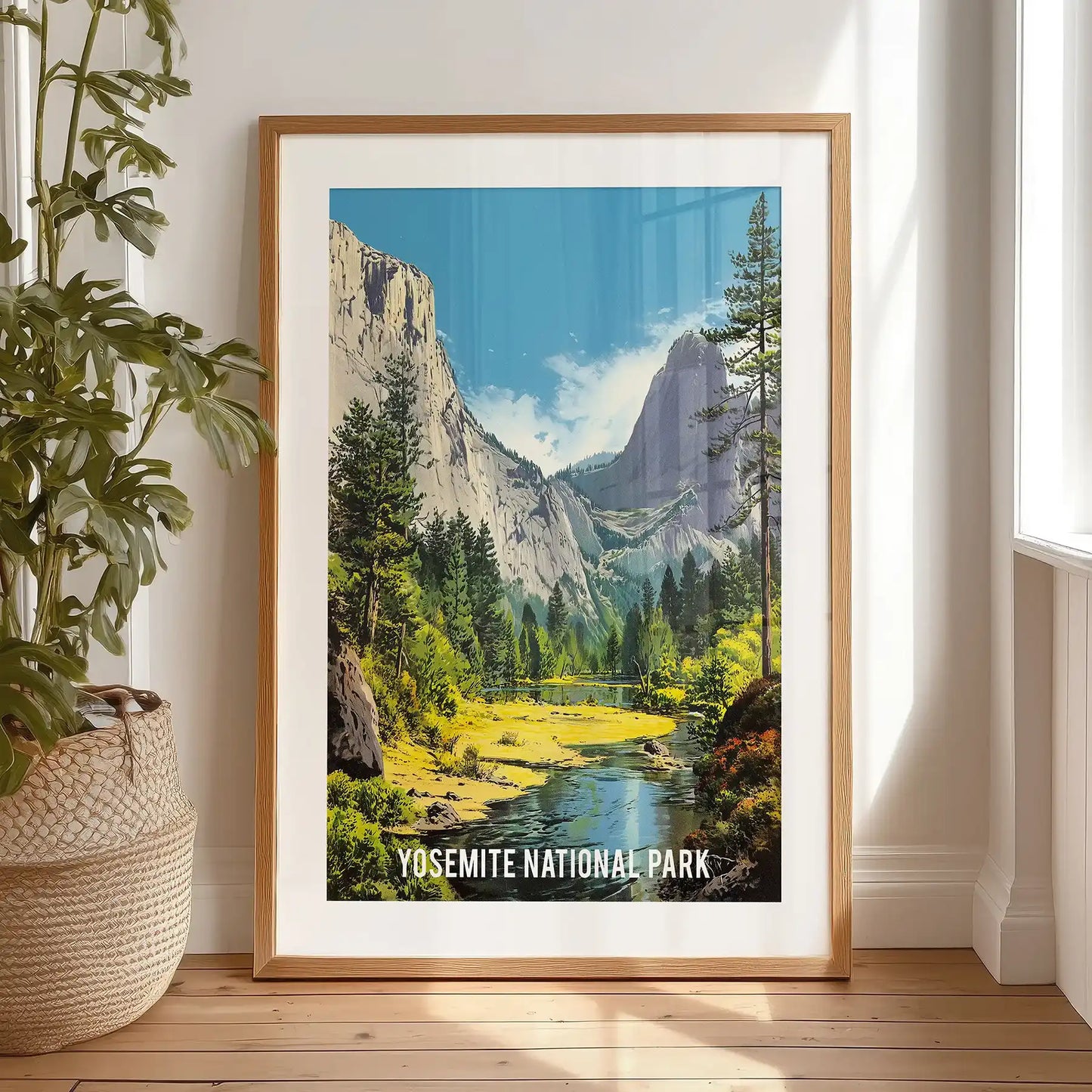 Yosemite National Park landscape, home wall art with a black-matted frame, is propped on the bedroom floor for easy display.