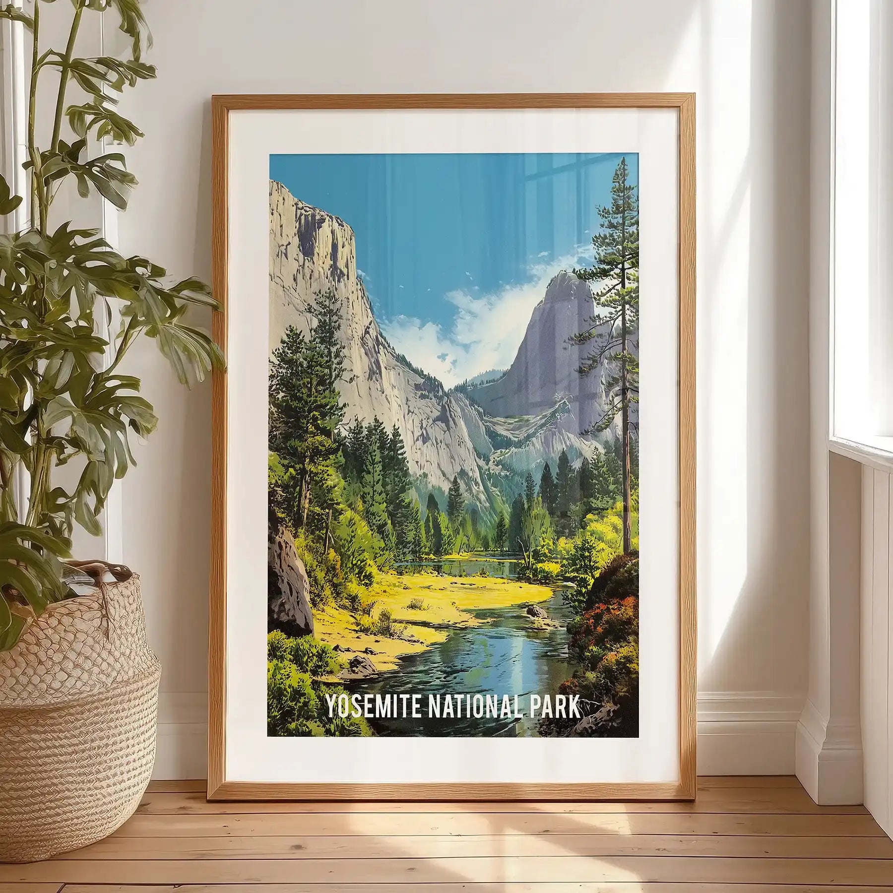Yosemite National Park landscape, home wall art with a black-matted frame, is propped on the bedroom floor for easy display.
