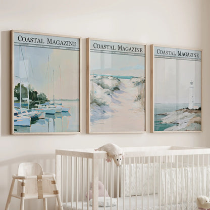 Coastal gallery wall set of three in oak wood frames, displayed over a bassinet in a baby's room.