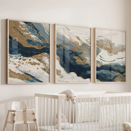 Wood-framed trio of navy and gold abstract prints hangs above the baby’s cot, adding soothing color with a modern, airy profile.