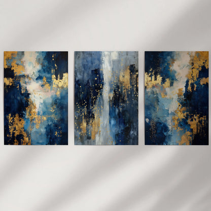 Three unframed wall panels with abstract navy forms and gold accents suit a minimalist wall, keeping the look crisp, modern, and uncluttered.