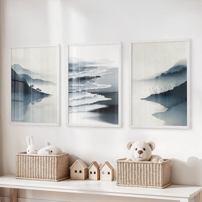 Three white-framed minimalist shoreline prints float above the toy bench in the children’s room, adding airy coastal calm.