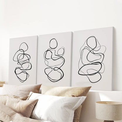 Scribble line art becomes a 3-piece canvas triptych for the bedroom, scaled to sit cleanly above the bed headboard with understated texture.