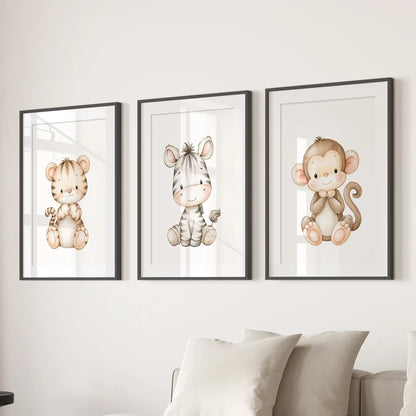 Tiger, zebra and monkey prints hang in three matted black frames above a sofa.