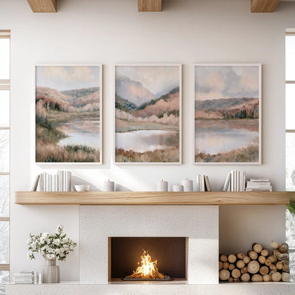 Misty forest and distant mountains, a 3-piece set of white-framed prints, centers the living room over the fireplace with layered, soft-toned scenery.