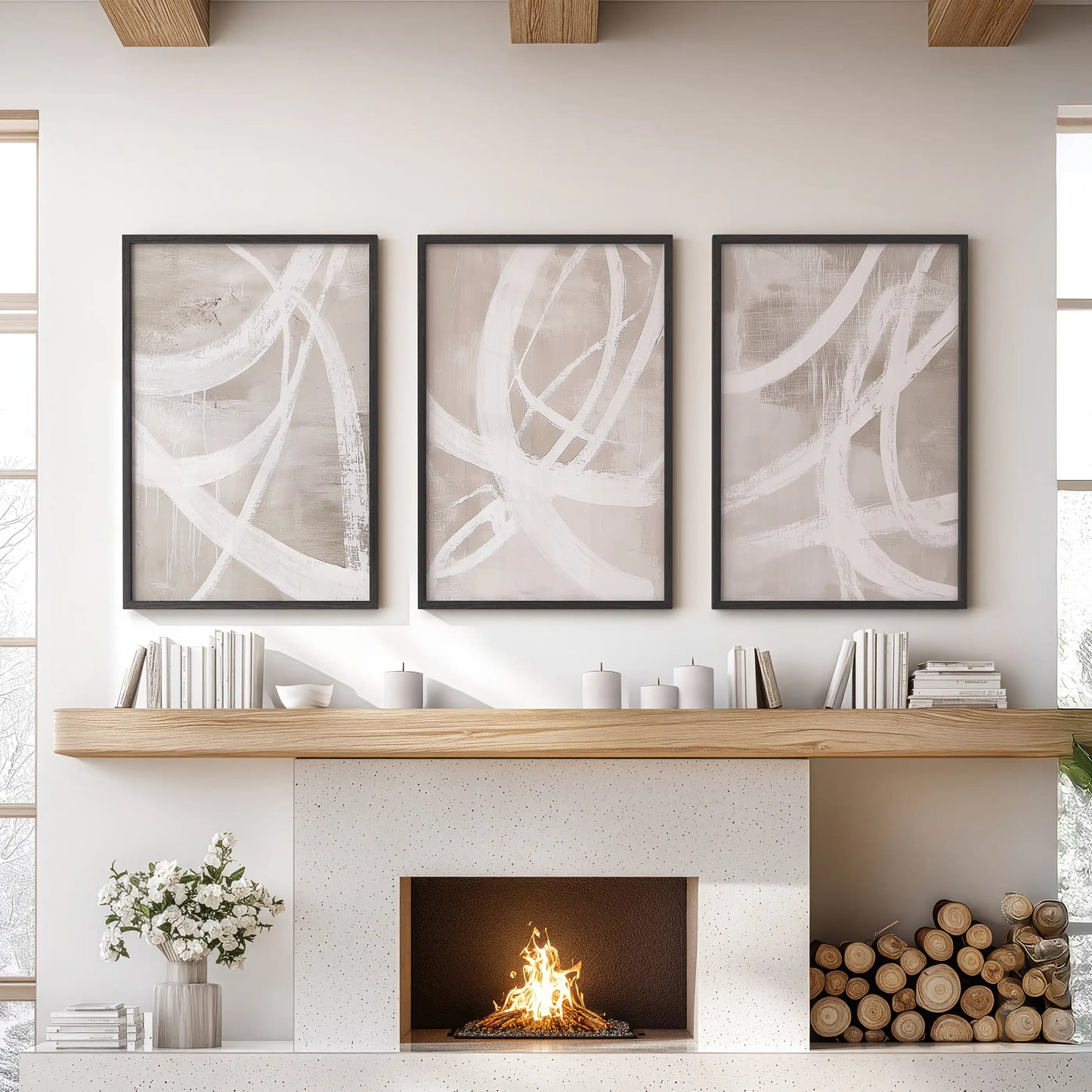 Neutral beige brush strokes wall art, 3-piece set, for the living room in slim black frames, arranged above the mantel.