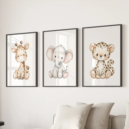 A seated giraffe, gray elephant and spotted leopard each occupy a white background in three black-framed prints above a sofa.